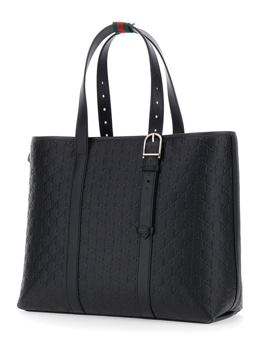 Gucci Men 'Emblem' Black Tote Bag With All-Over Embossed Gg Motif In Leather Man
